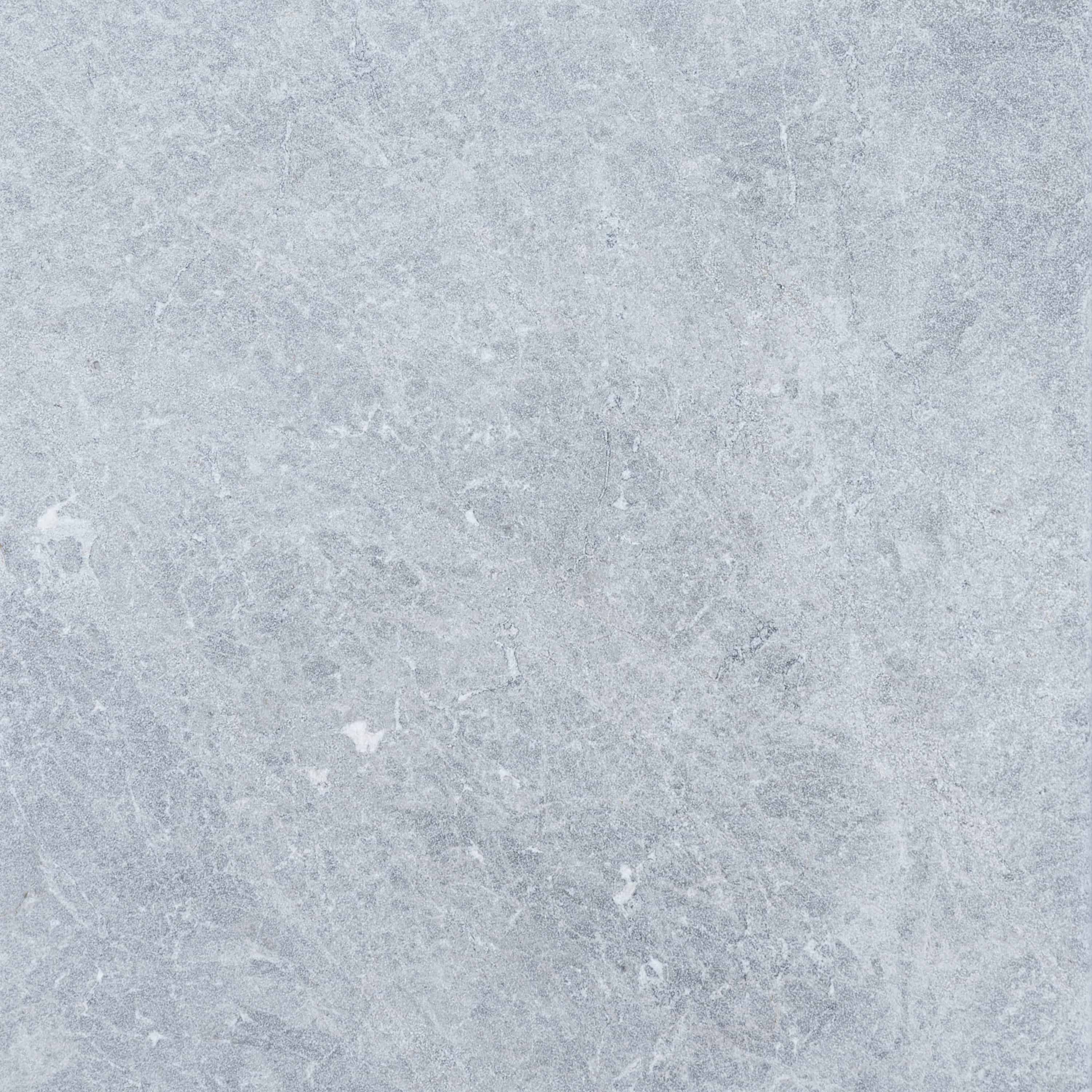 Close-up of Tundra Grey Marble from STONELUX, showcasing its natural stone texture with soft grey tones and subtle white veining. Ideal for hardscape projects, pool builds, and renovations, offering a premium, elegant finish.