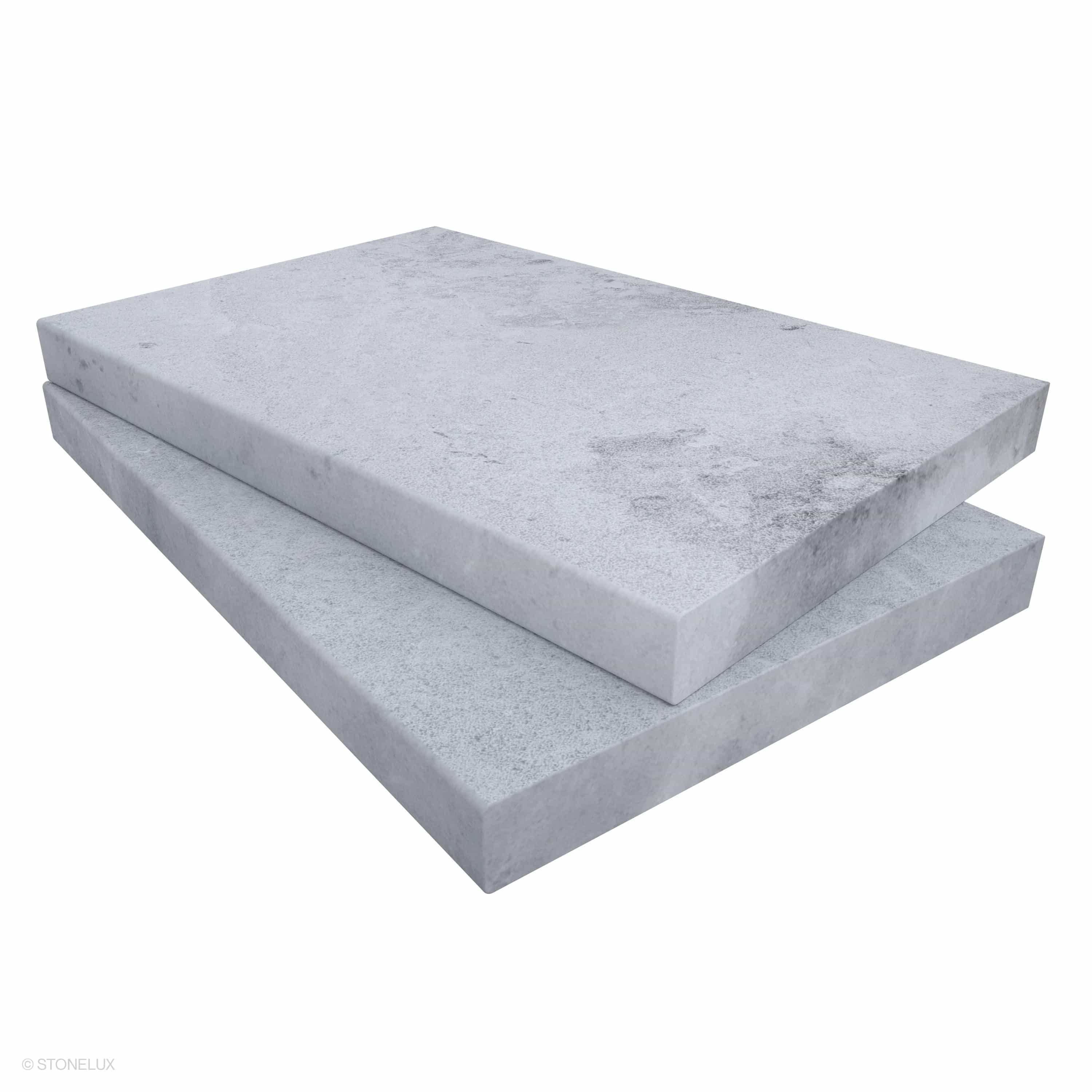STONELUX Tundra Grey Marble Sand Blasted Coping, size 16x24x2, showcases a sleek sandblasted finish with eased edges. The marble's subtle grey tones and natural veining offer a sophisticated touch, ideal for pool edges, steps, and wall caps.