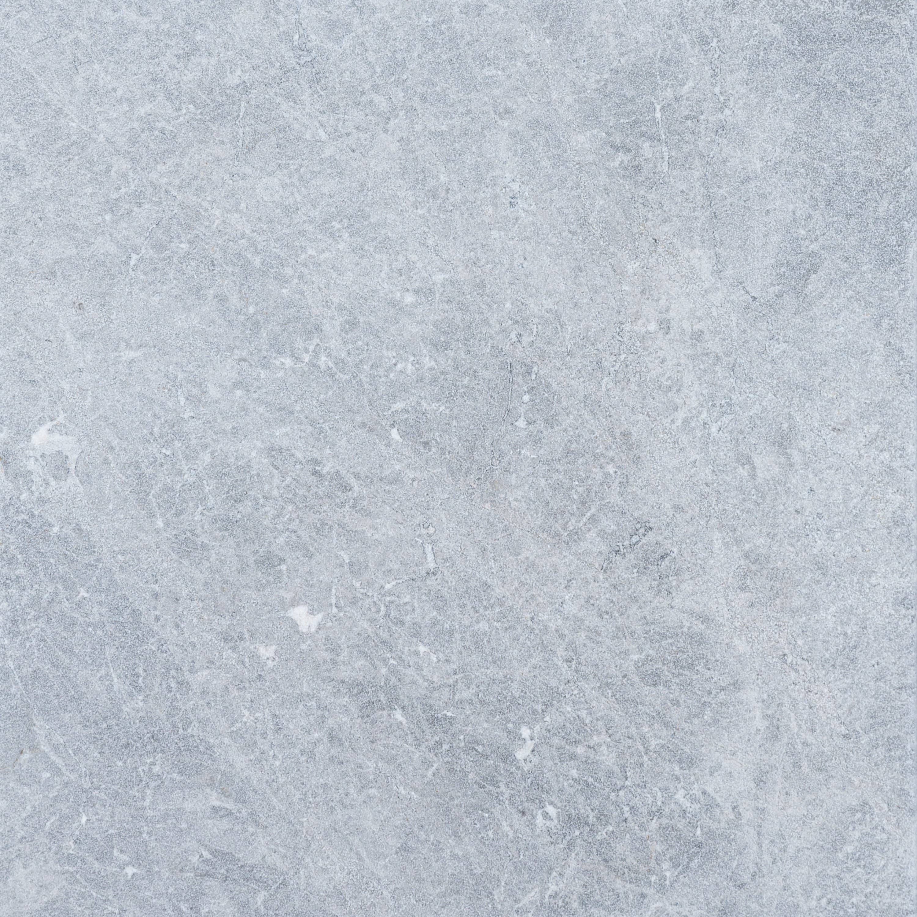 Close-up of Tundra Grey Marble from STONELUX, showcasing its natural stone texture with soft grey tones and subtle white veining. Ideal for hardscape projects, pool builds, and renovations, offering a premium, elegant finish.