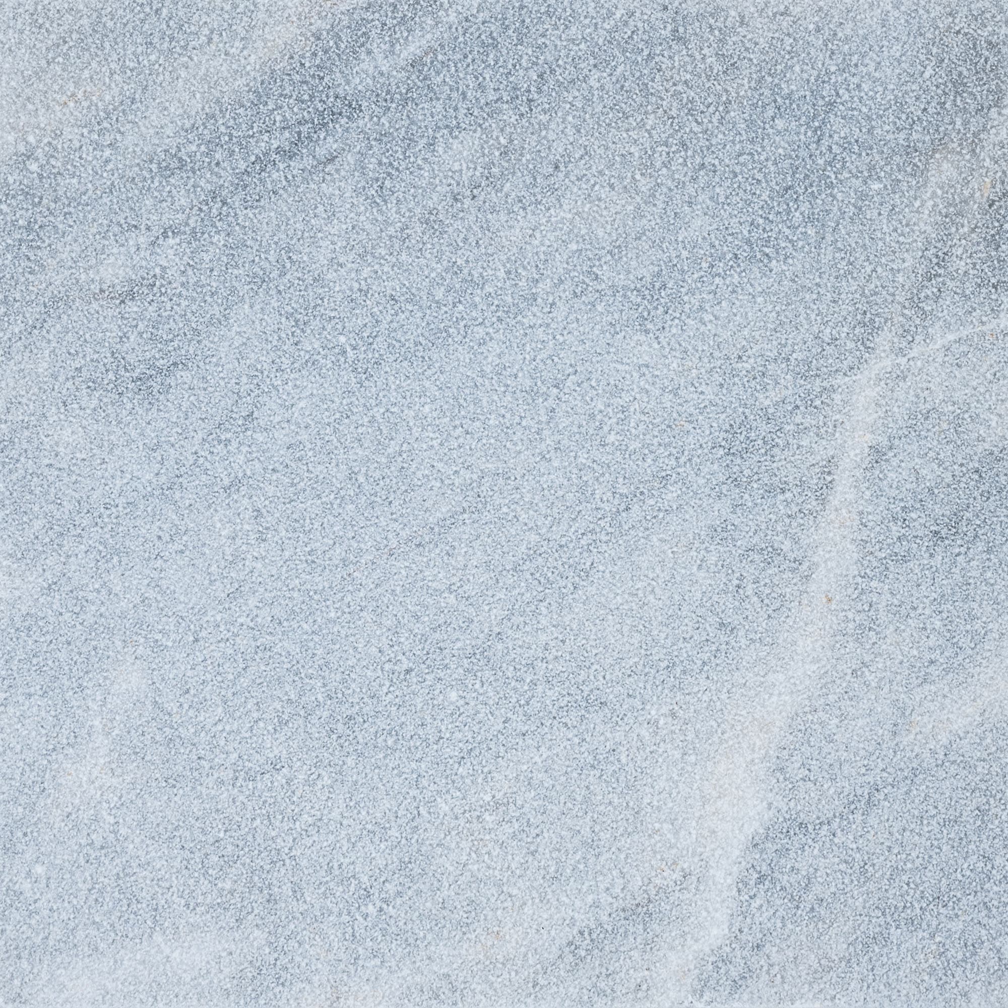 Close-up view of the Arctic Grey Marble Sand Blasted 24x24 3cm Paver by STONELUX. This natural stone features a fine sandblasted finish with a soft grey hue and subtle veining, ideal for modern hardscape projects and pool decks.