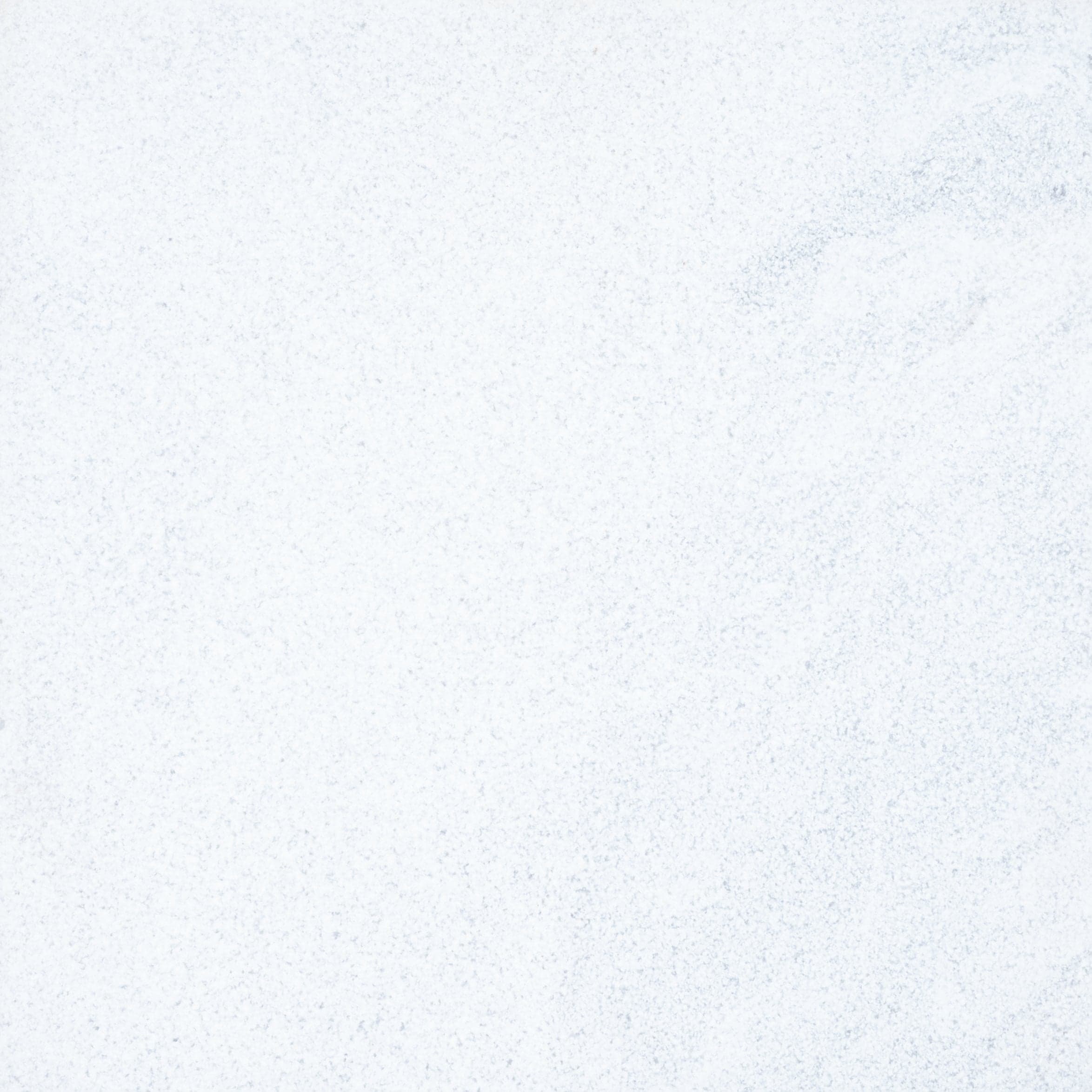 Close-up of Afyon White Marble by STONELUX, showcasing its smooth surface with subtle grey veining and a refined white texture. Ideal for luxury hardscape projects, this natural stone exudes elegance and timeless beauty. Perfect for pool builds and ren...