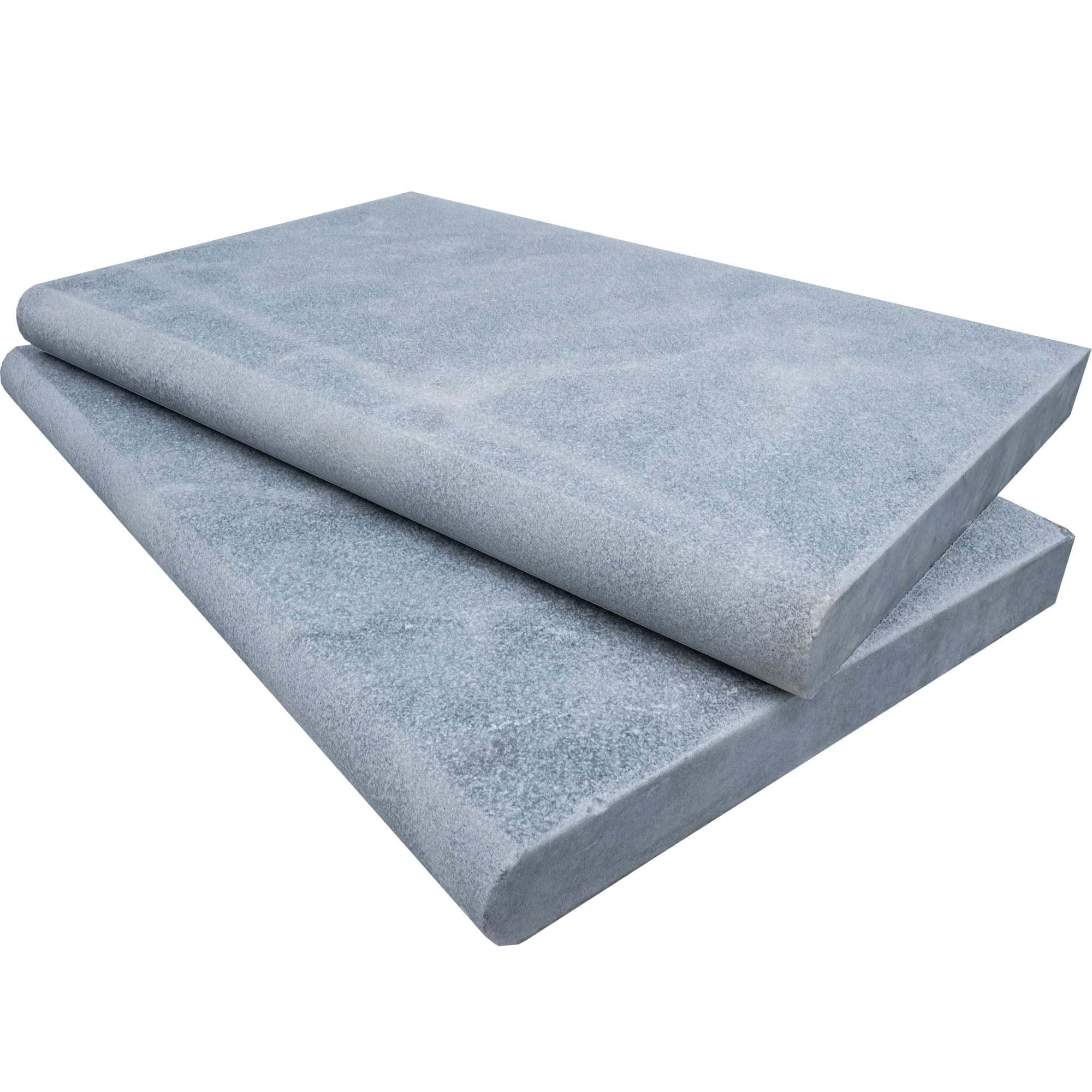 Close-up of Arctic Grey Marble Sand Blasted 16x24x2 Single Bullnose Coping by STONELUX. Features a smooth, sandblasted finish with soft grey tones and subtle veining, ideal for pool edging or patio accents. Perfect for high-end hardscape projects.