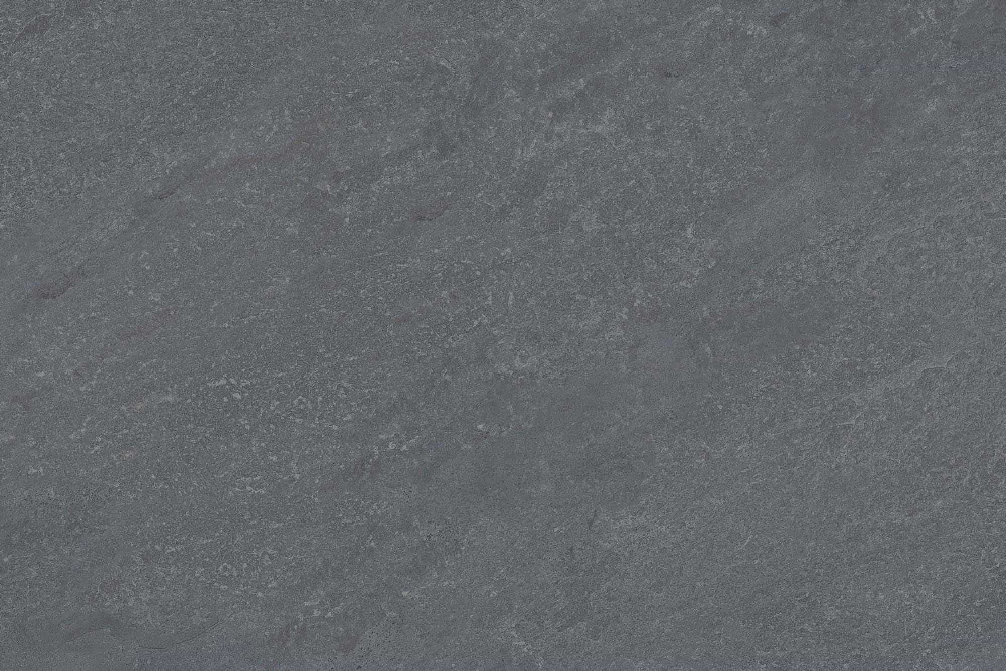 Close-up of the Dakota Gray Matte 24x36x2cm Rectified Porcelain Paver by STONELUX. The porcelain surface features a smooth, matte finish with subtle gray veining, offering a natural stone-like appearance ideal for modern outdoor hardscaping projects.