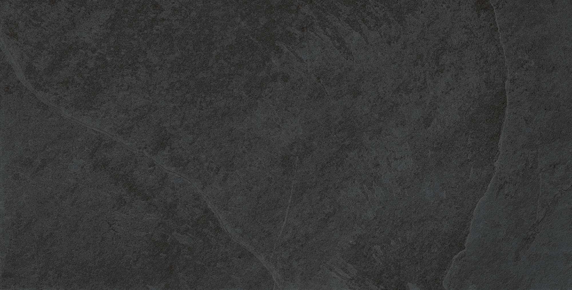 Close-up of the Overland Anthracite Matte 24x48x2cm Rectified Porcelain Paver showcasing its dark gray tone and subtle textured finish. Ideal for modern outdoor spaces, this porcelain paver offers a sleek, natural stone appearance for patios and pool d...