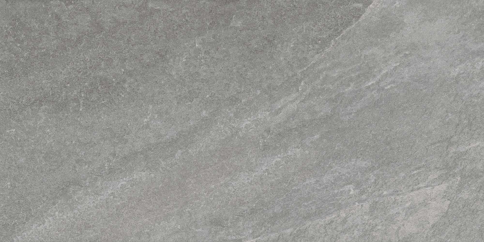 Close-up of the Rasa Gray Matte 24x48x2cm Rectified Porcelain Paver by STONELUX. This porcelain paver features a smooth matte finish with a natural stone appearance, showcasing subtle gray veining and a textured surface ideal for modern hardscape proje...