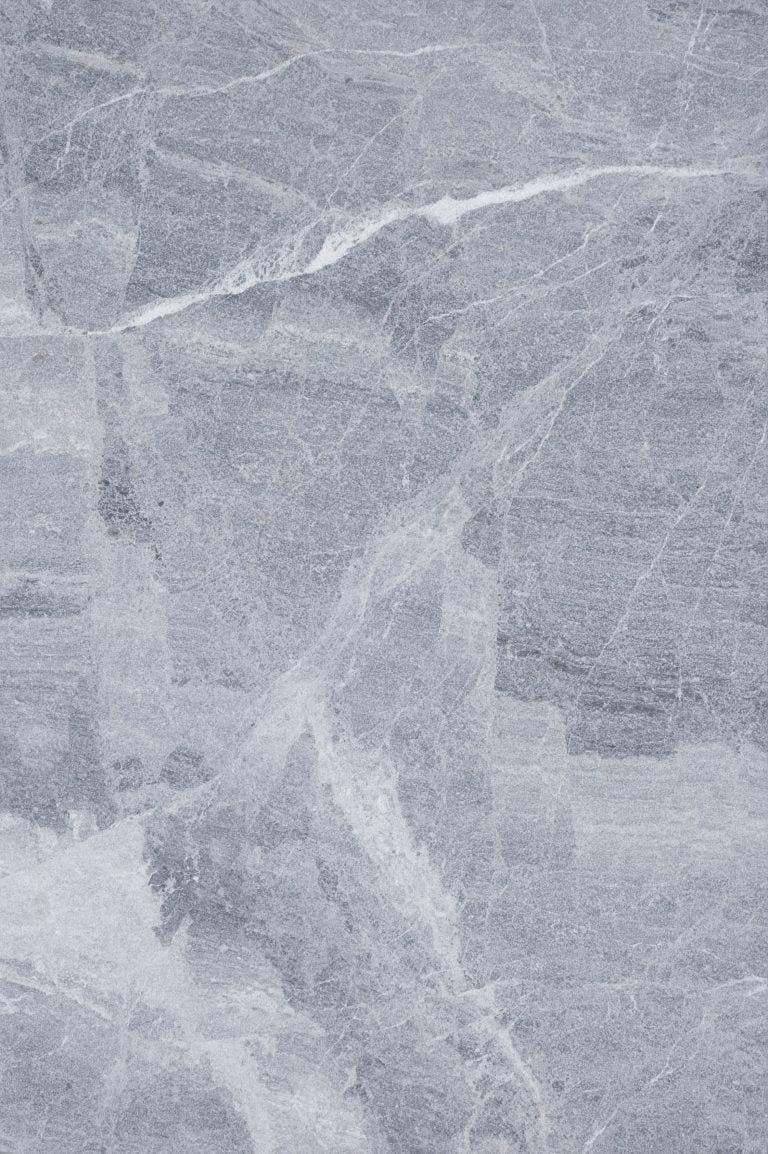 Close-up view of Aegean Grey Marble by STONELUX, showcasing its natural stone texture with subtle grey tones and delicate white veining. Ideal for luxury hardscape projects, pool builds, and renovations. Perfect for those seeking premium marble aesthet...
