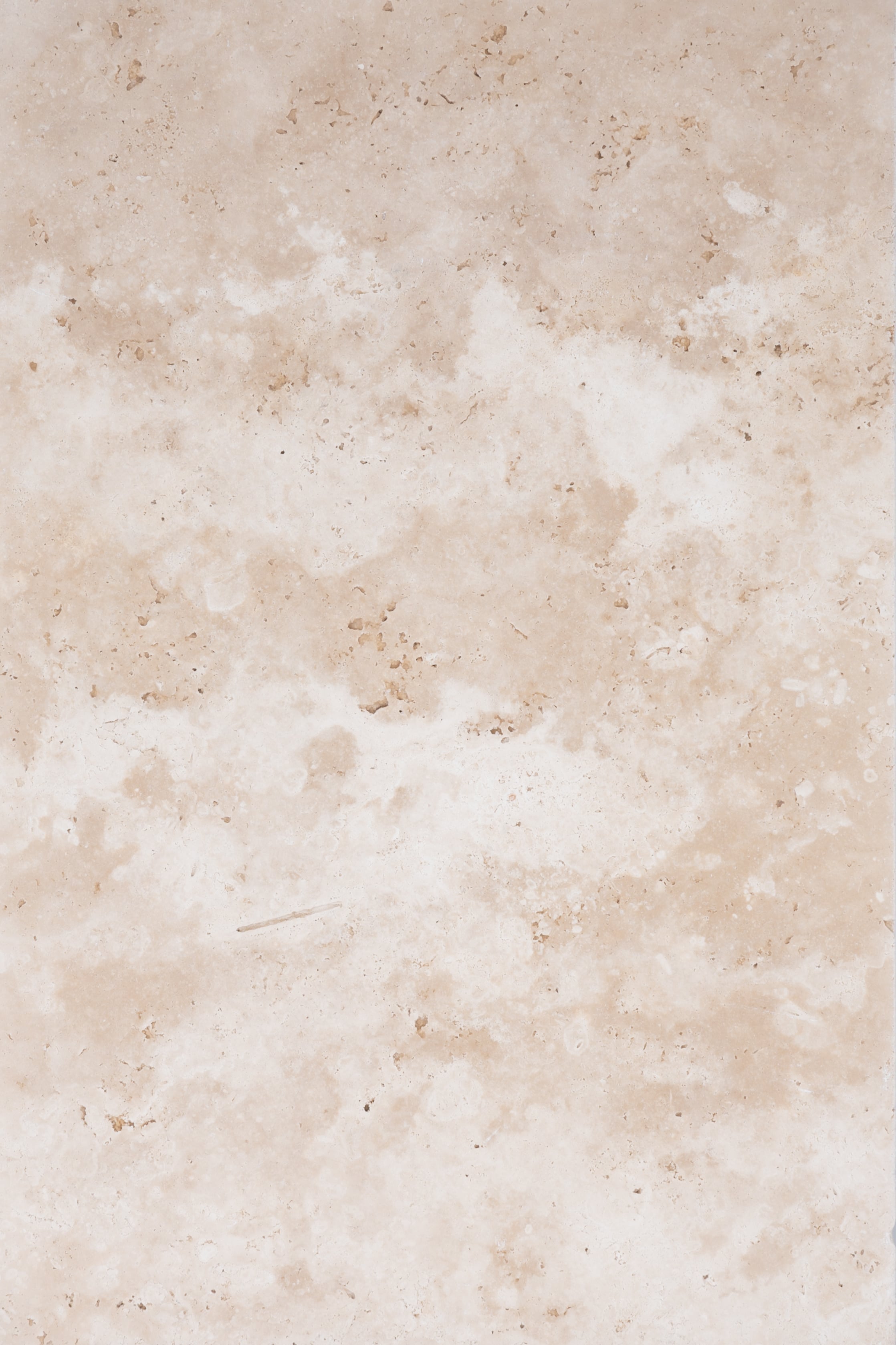 Close-up of Stonelux Ivory Travertine natural stone showcasing a creamy beige hue with subtle veining and a polished texture. Ideal for pool decks, patios, and hardscape projects, offering a luxurious and timeless appeal. Perfect for modern or traditio...