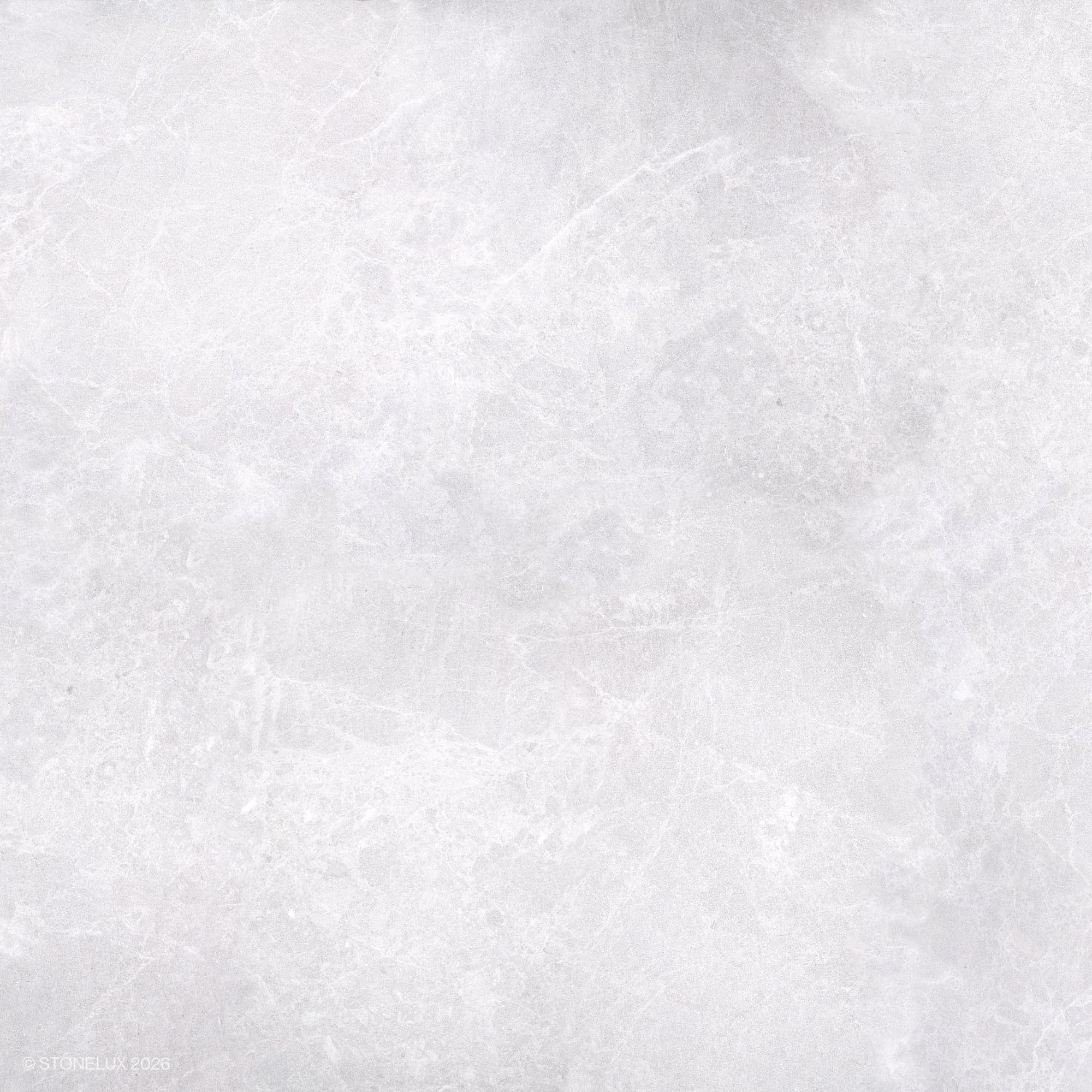Close-up of STONELUX Pera Cream Marble showcasing its smooth, creamy beige surface with subtle veining. This natural stone offers a refined texture ideal for elegant hardscape projects and pool builds. Perfect for luxurious and sophisticated designs.