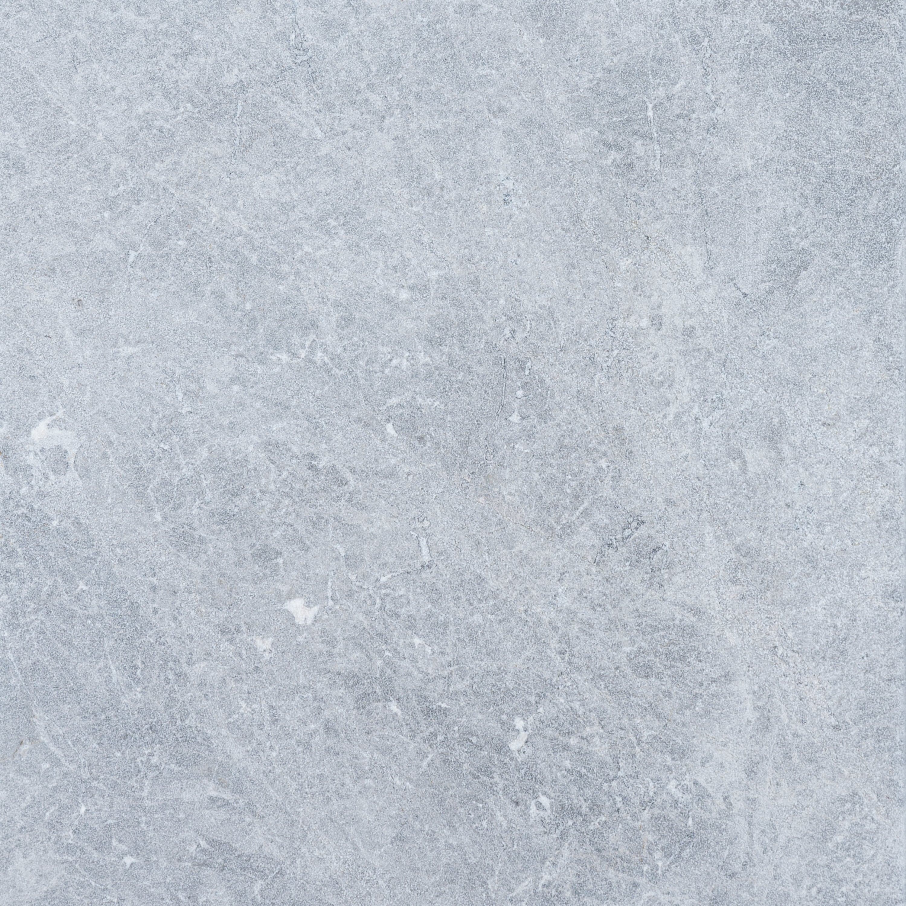 Close-up of Tundra Grey Marble from STONELUX, showcasing its natural stone texture with soft grey tones and subtle white veining. Ideal for hardscape projects, pool builds, and renovations, offering a premium, elegant finish.