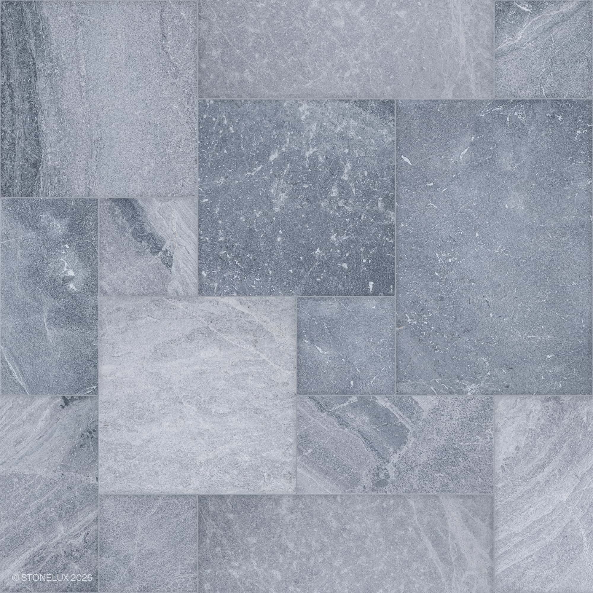 Close-up of Aegean Grey Marble Sand Blasted French Pattern 3cm Paver by STONELUX. The natural stone features a subtle grey hue with intricate veining and a textured sandblasted finish, ideal for elegant hardscape projects and pool areas.