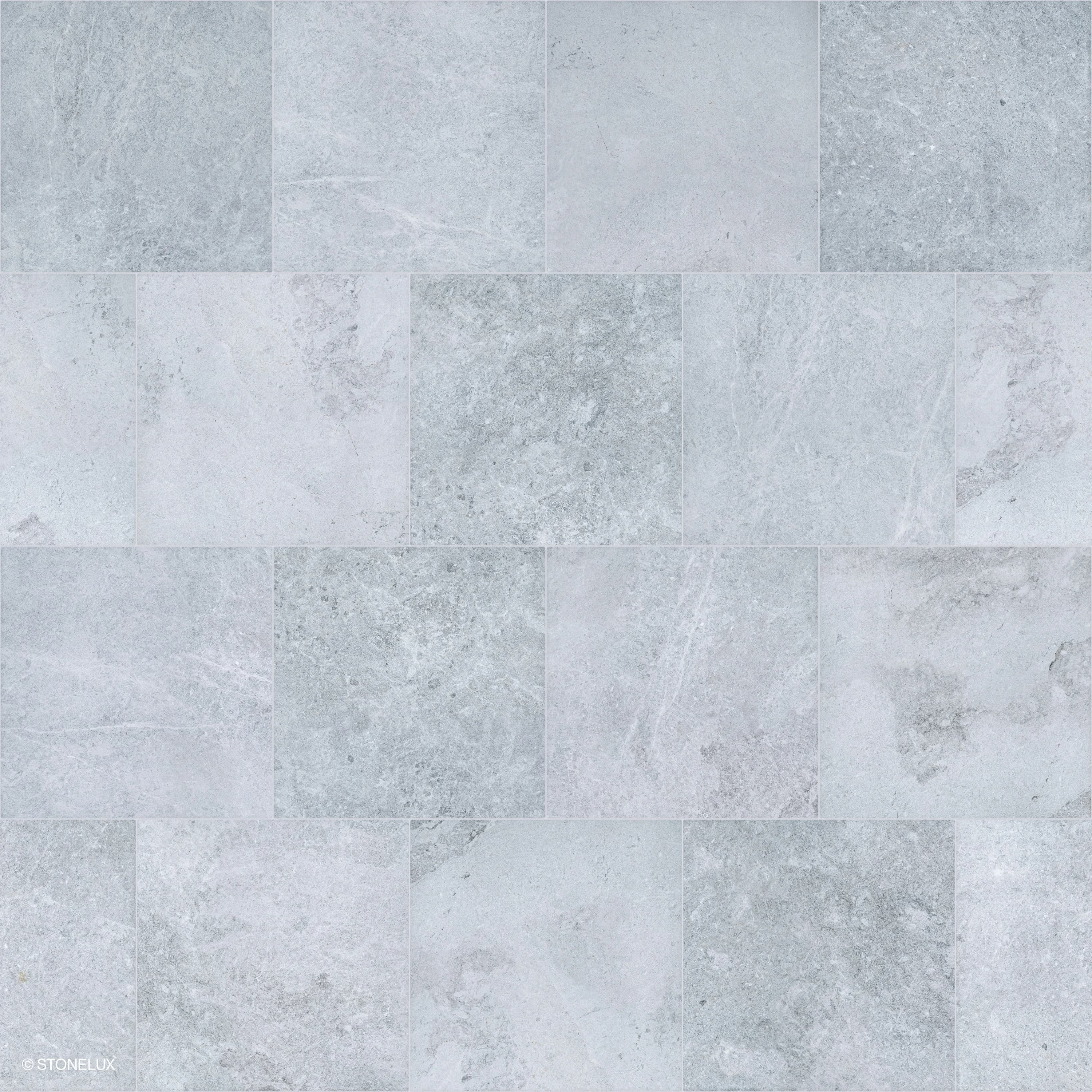 Close-up of Tundra Grey Marble Sand Blasted 12x24 3cm Paver by STONELUX, showcasing its subtle grey tones, fine sandblasted texture, and delicate veining. Ideal for modern hardscape projects, pool decks, or patios, providing a sophisticated, natural st...