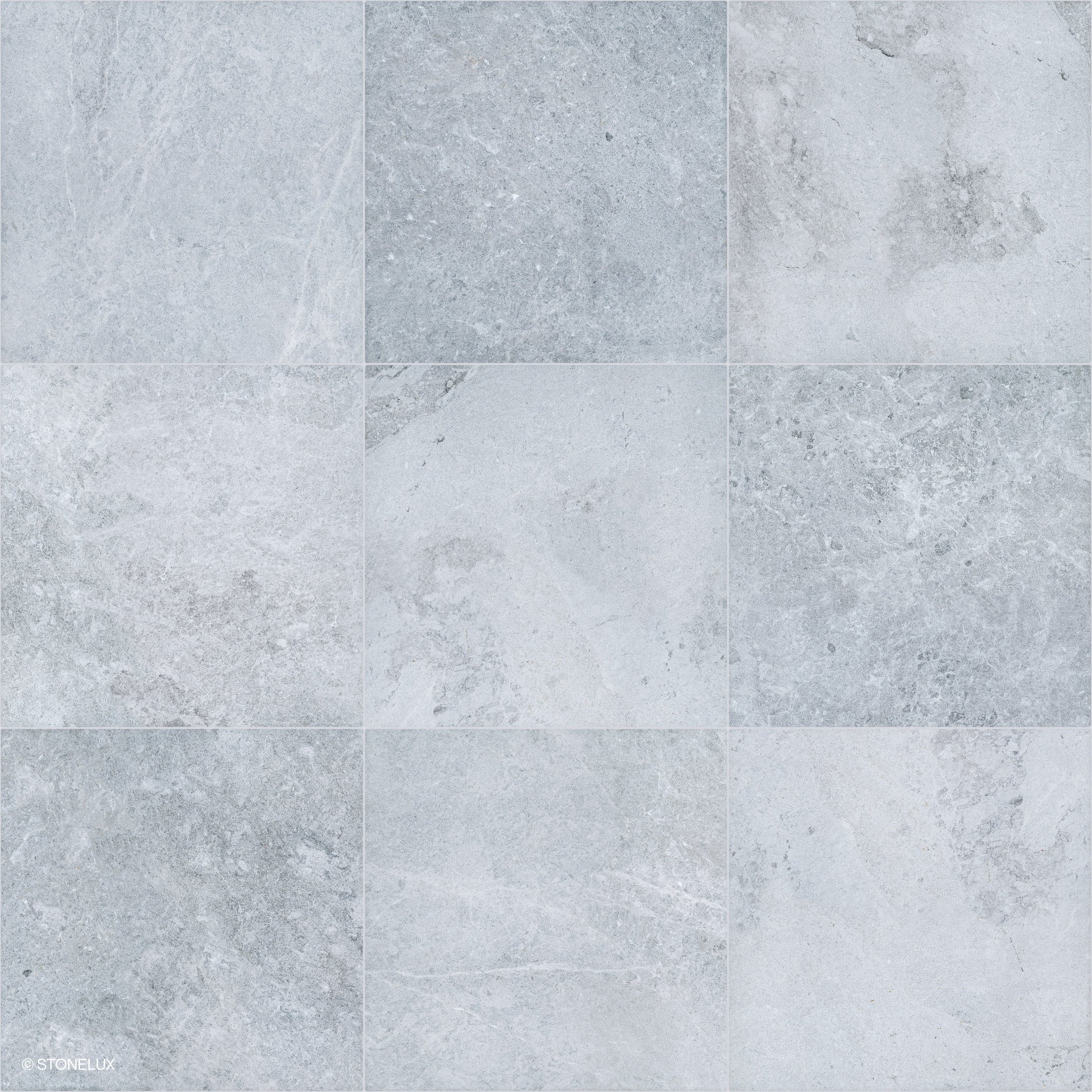 Close-up of Tundra Grey Marble Sand Blasted 24x24 3cm Paver by STONELUX, showcasing a refined sandblasted finish. The marble features subtle grey tones with delicate veining, ideal for sophisticated hardscape designs and poolside installations.