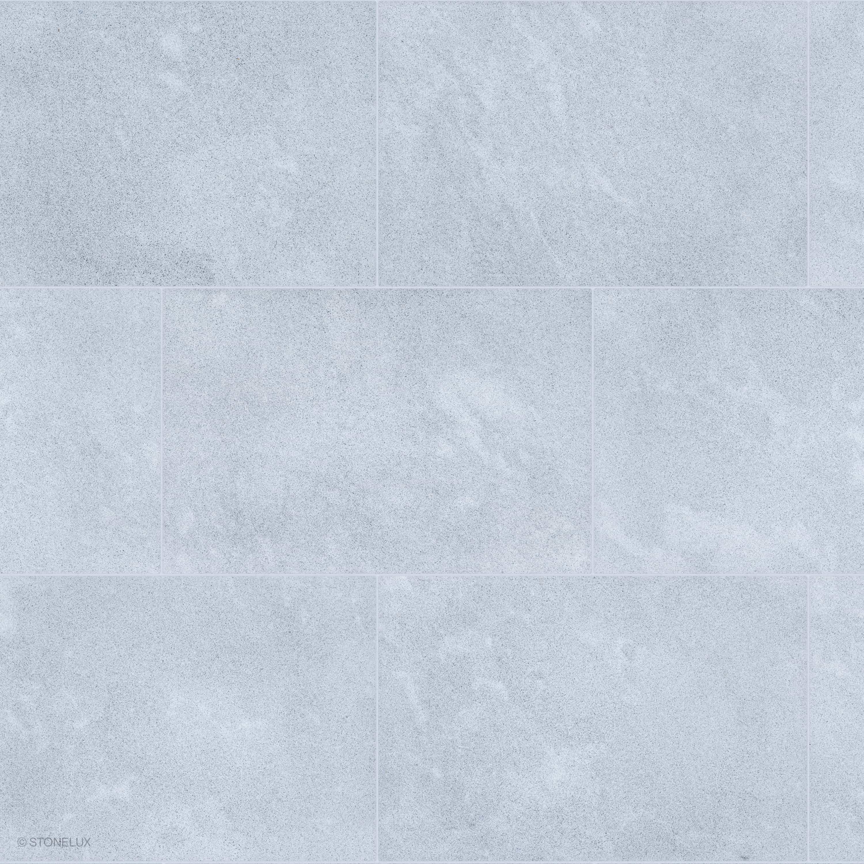 Product view of Afyon Grey Marble Sand Blasted 16x24 3cm Paver, showing a light cool-grey marble surface with fine blue-grey speckling, soft cloudy movement, and its textured finish.