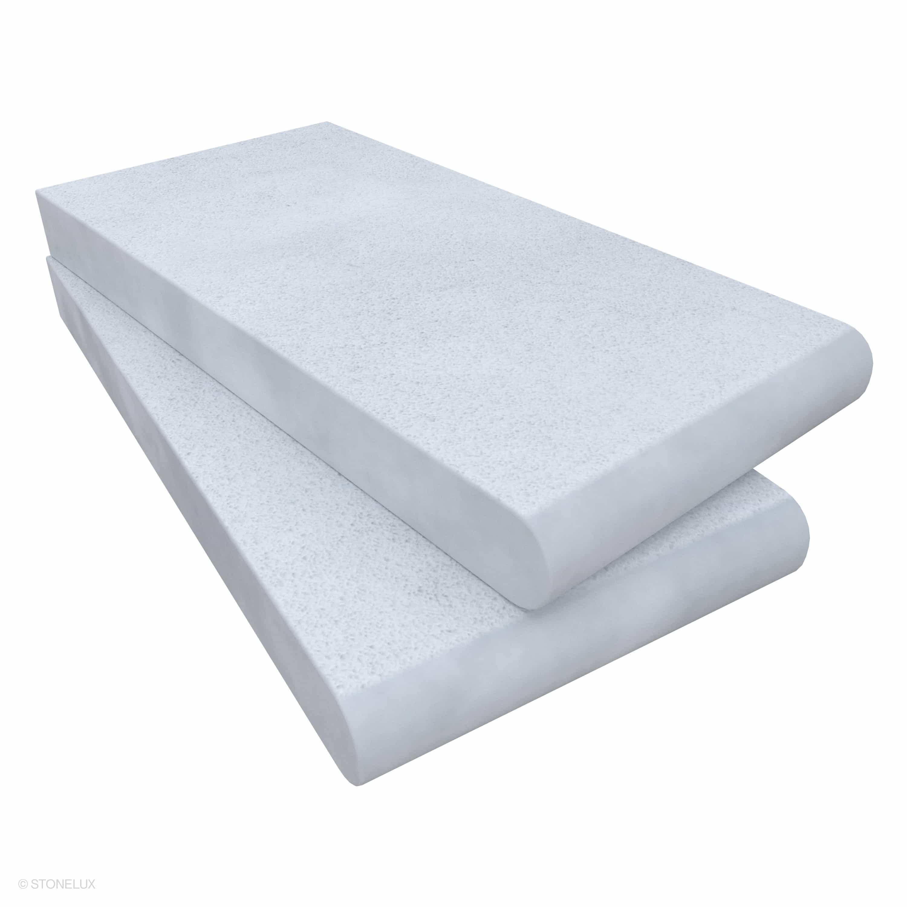 Close-up image of STONELUX's Afyon White Marble Sand Blasted Single Bullnose Coping, showcasing its elegant sandblasted finish with subtle veining. The 6x12x3cm marble piece features a smooth, rounded edge, ideal for pool coping and architectural accents.