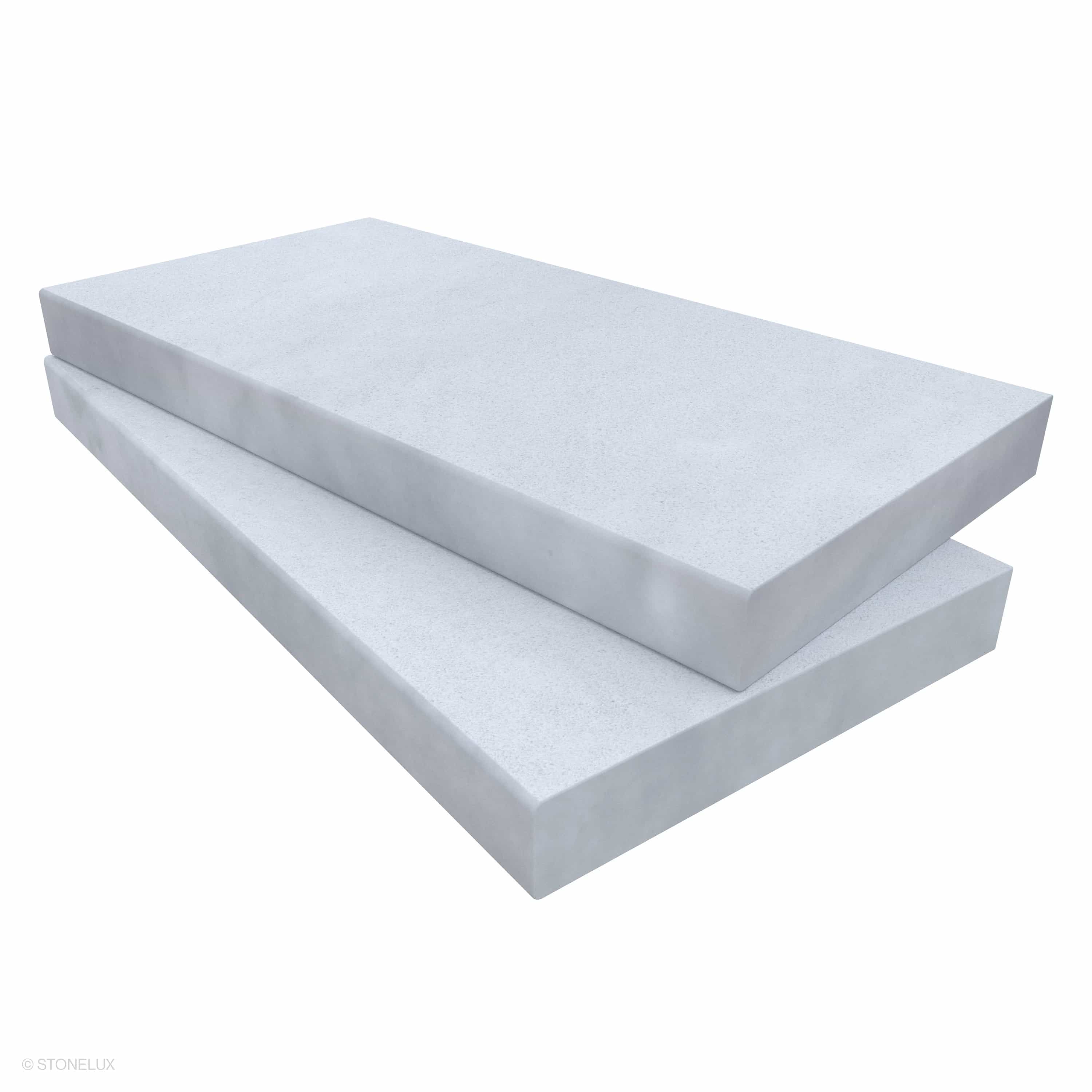 Close-up of Afyon White Marble Sand Blasted 12x24x2 Eased Edge Coping by STONELUX. The marble features a sandblasted finish with subtle veining, showcasing its smooth, elegant texture. Ideal for pool edges, wall caps, or steps.