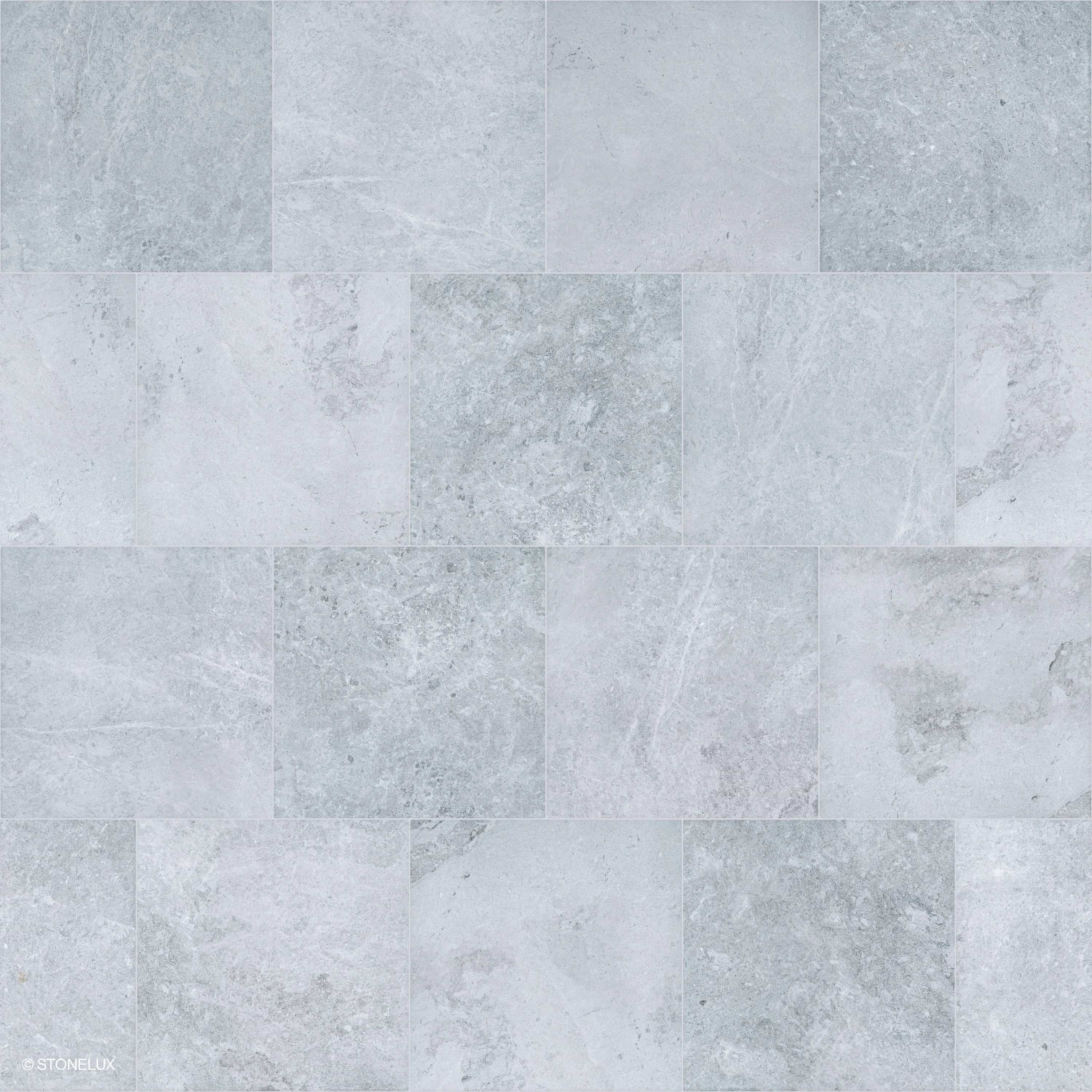 Close-up of Tundra Grey Marble Sand Blasted 12x24 3cm Paver by STONELUX, showcasing its subtle grey tones, fine sandblasted texture, and delicate veining. Ideal for modern hardscape projects, pool decks, or patios, providing a sophisticated, natural st...