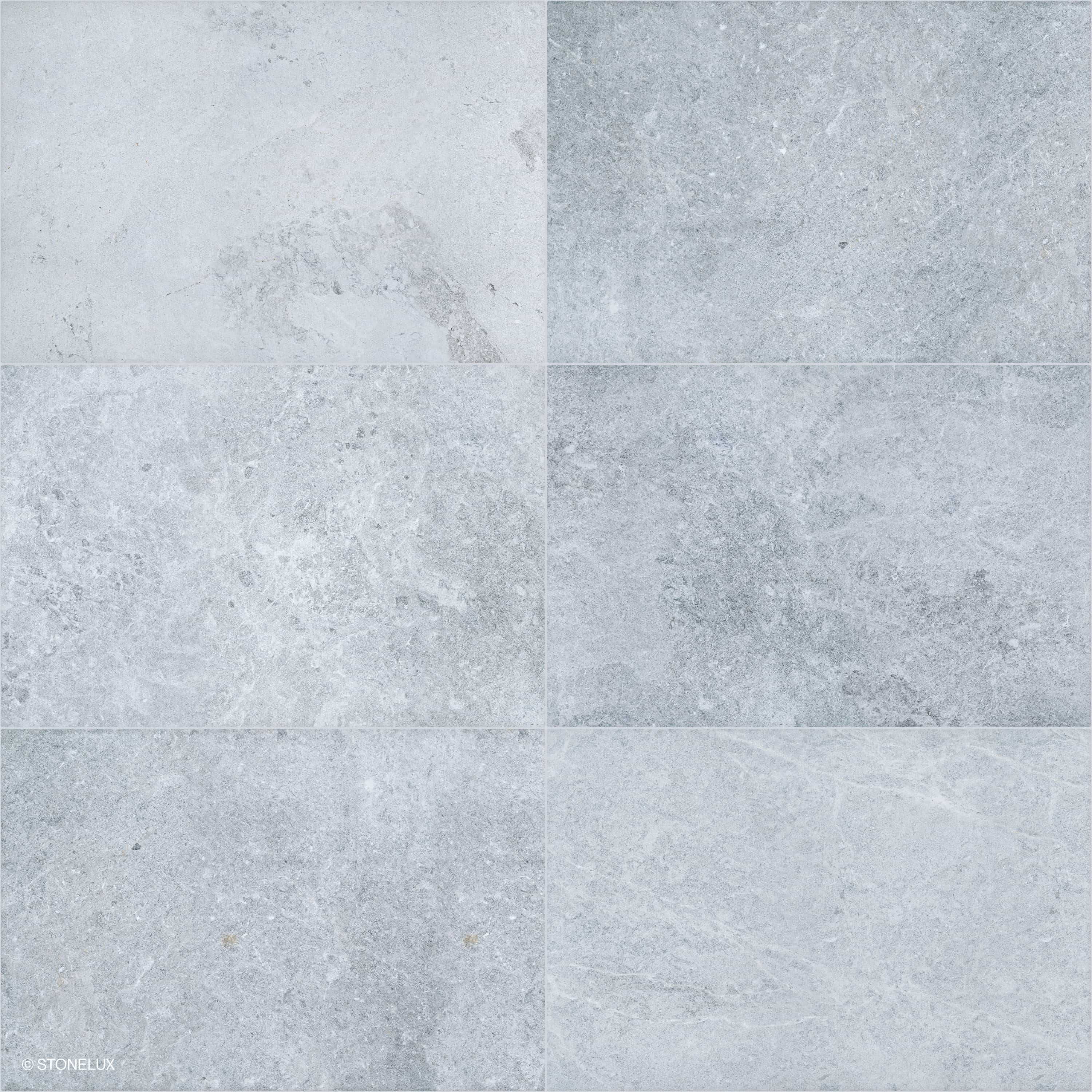 Close-up of the Tundra Grey Marble Sand Blasted 24x36 3cm Paver. This premium marble features a sandblasted finish with subtle grey tones and intricate veining, ideal for elegant hardscape projects and pool builds. Perfect for modern outdoor spaces.