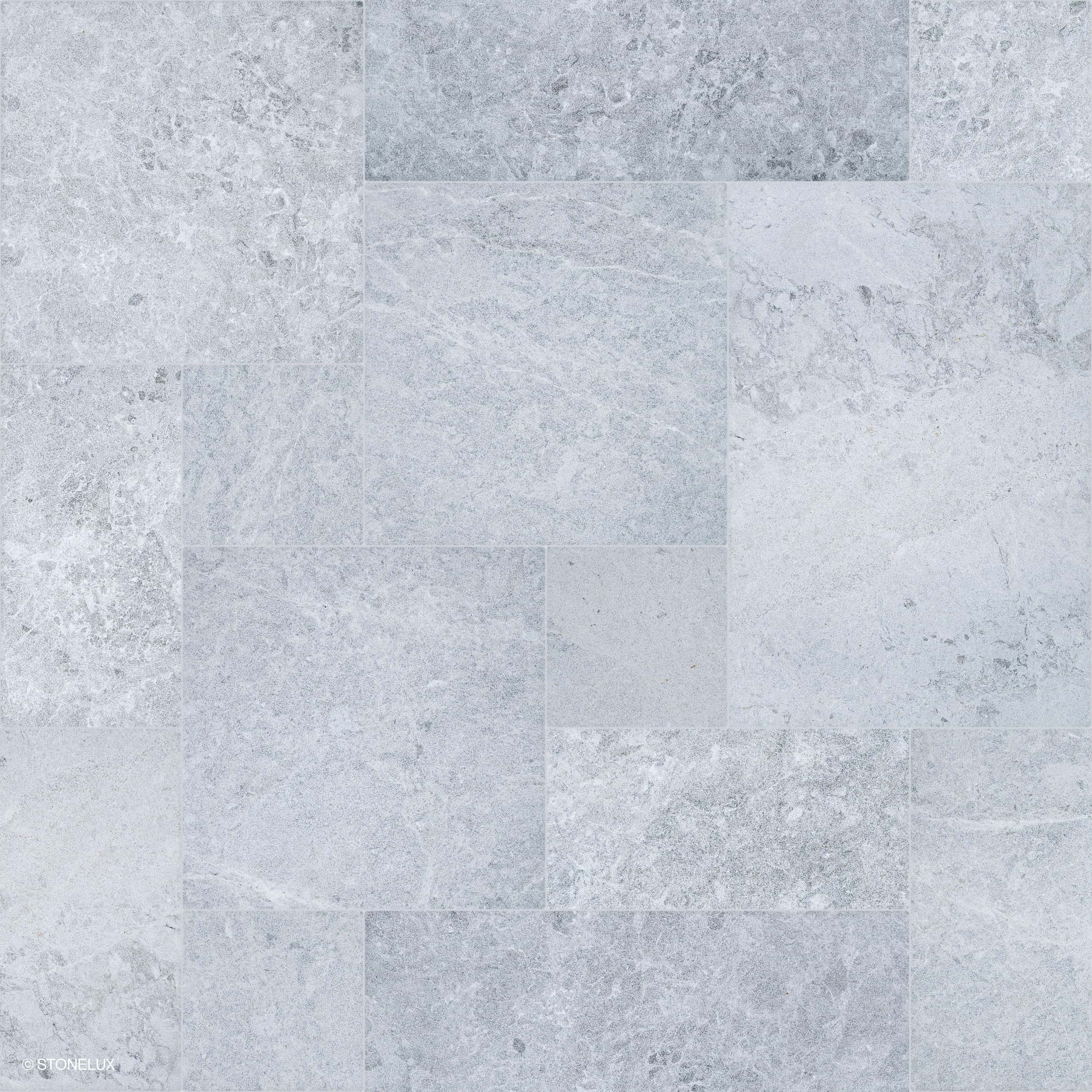 Close-up of Tundra Grey Marble Sand Blasted French Pattern 3cm Paver by STONELUX. Features a subtle grey tone with a sandblasted texture, showcasing natural veining and a refined matte finish. Ideal for premium hardscape projects and pool decks.