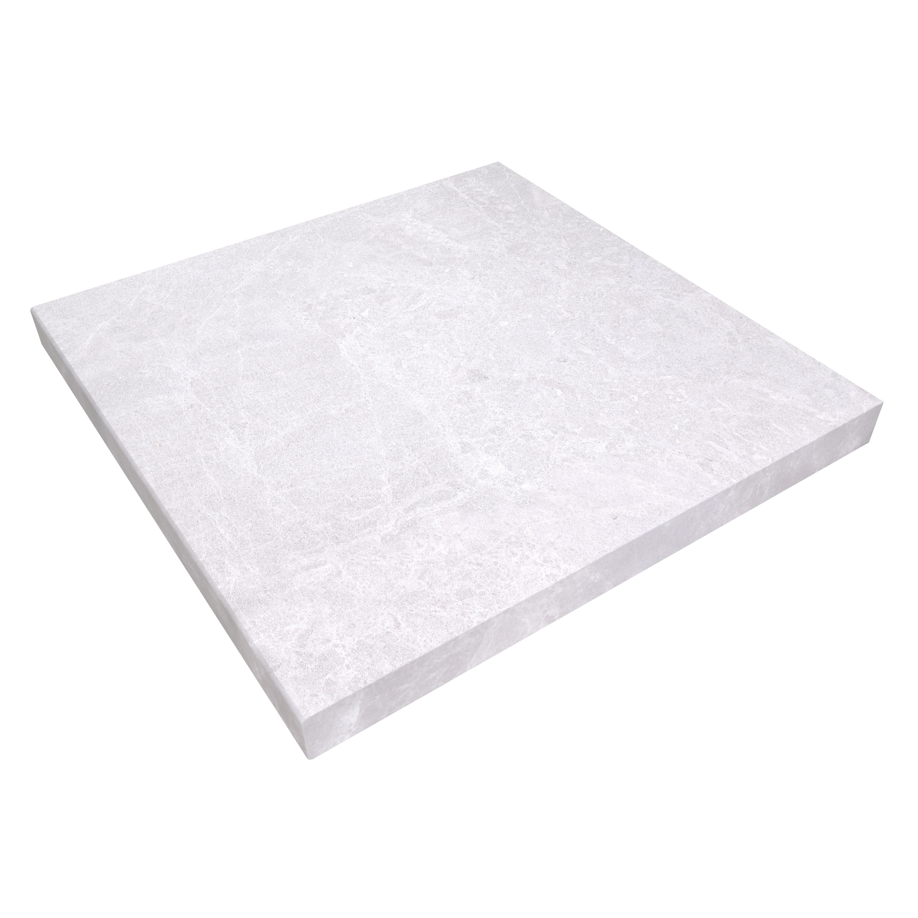 Close-up of STONELUX's Pera Cream Marble Sand Blasted 24x24x2 Four Side Eased Edge Cap. This marble piece features a sandblasted finish with subtle veining, ideal for pool edges or wall tops, offering a modern and elegant appearance in hardscape projects.