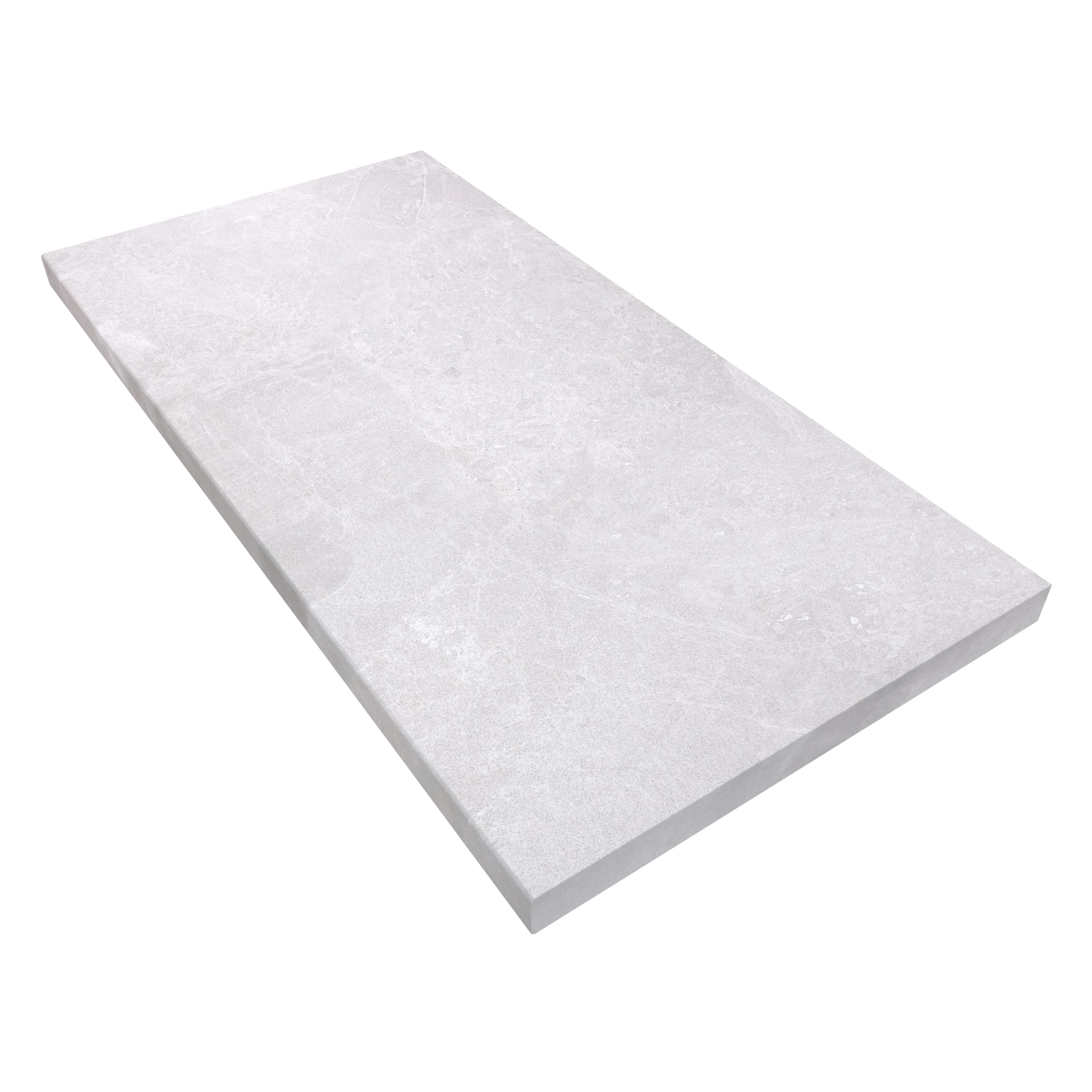 Close-up of the Pera Cream Marble Sand Blasted 24x48x2 Eased Edge Coping. This marble piece features a sandblasted finish with a light cream hue and subtle veining, ideal for pool edges or wall caps. Its 2-inch thickness and eased edge provide a sleek,...