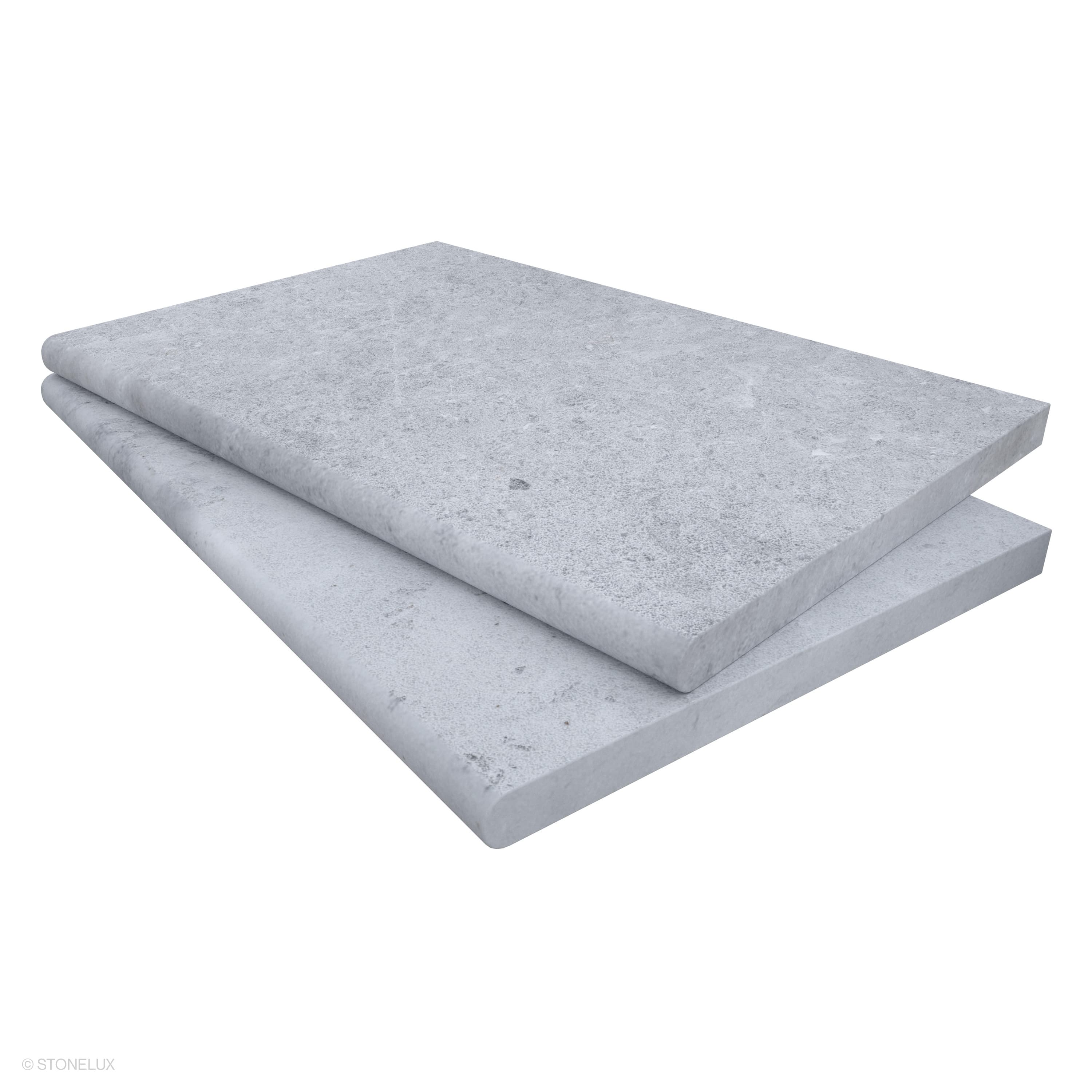 Close-up of STONELUX Tundra Grey Marble Sand Blasted 16x24x3cm Single Bullnose Coping. The marble displays a textured, sandblasted finish with subtle grey veining, ideal for pool edges and wall caps. Durable and elegant, perfect for luxury hardscape pr...