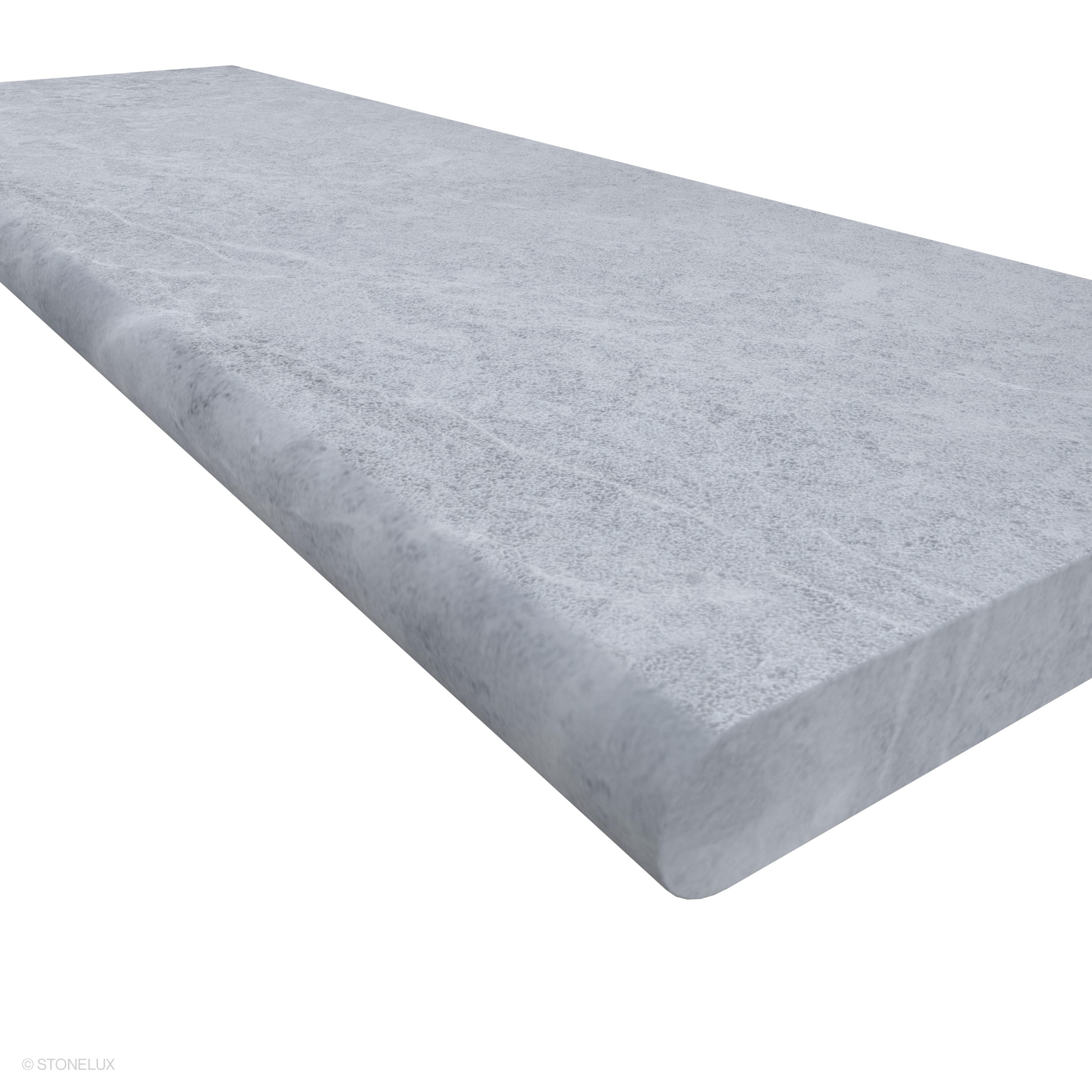 Close-up of the Tundra Grey Marble Sand Blasted 16x48x2 Single Bullnose Coping, showcasing its smooth sandblasted finish and subtle grey veining. The marble's refined texture and elegant bullnose edge make it ideal for pool edges and outdoor steps.