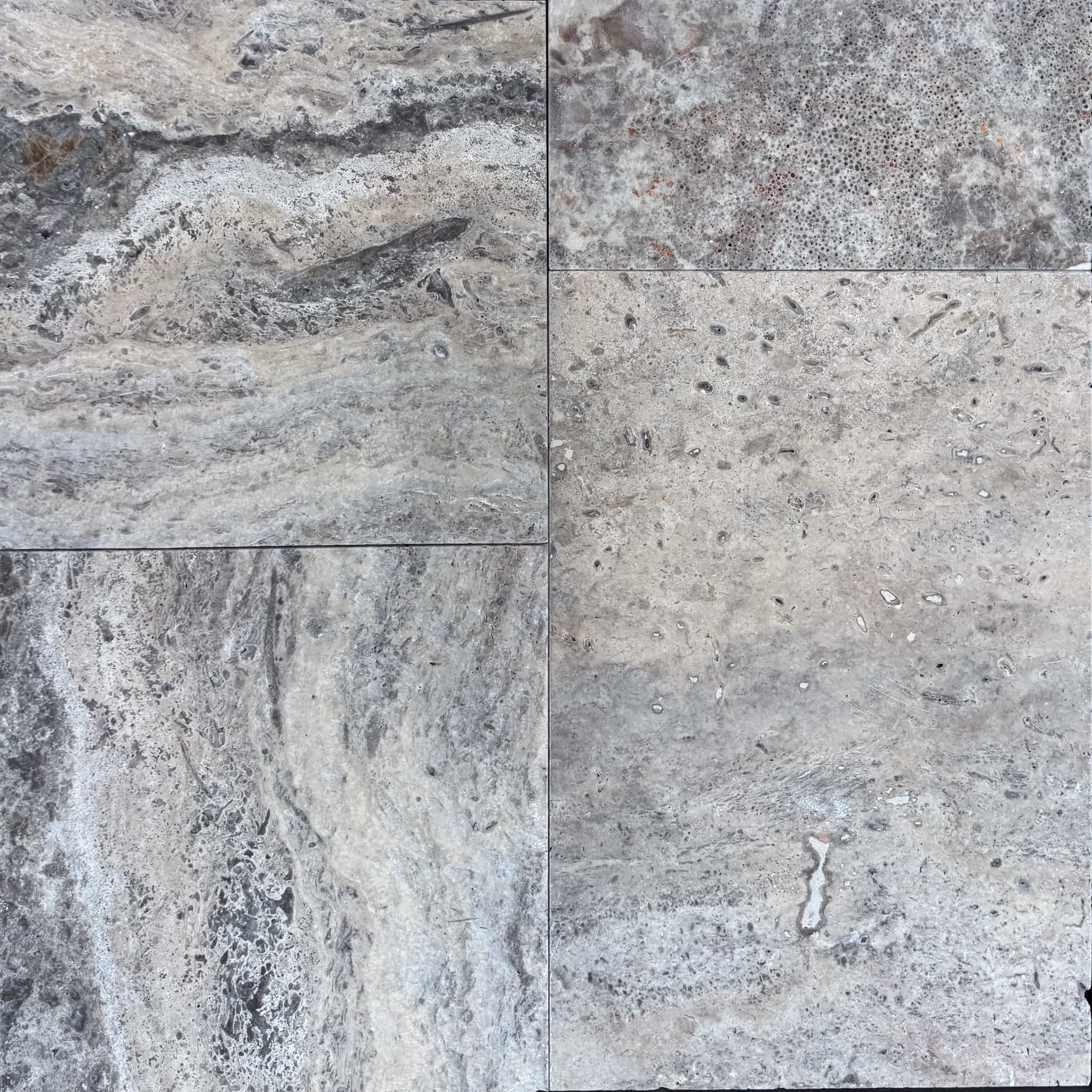Close-up of Silver Travertine Tumbled French Pattern 3cm Paver - Select by STONELUX. Showcases natural stone texture with intricate veining and a soft, tumbled finish. Ideal for hardscape projects, offering a blend of gray and beige tones for elegant d...