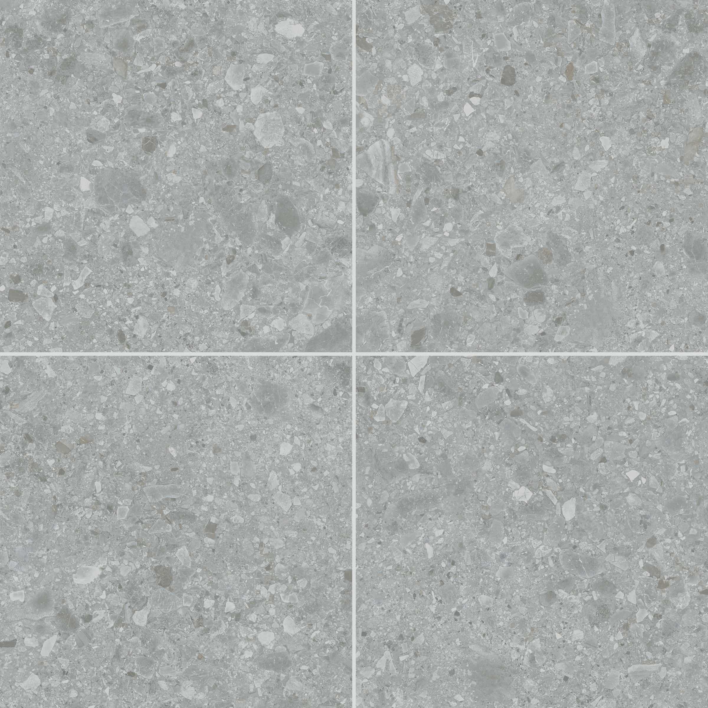 Close-up of the Terrazo Grigio Matte 24x24x2cm Rectified Porcelain Paver by STONELUX. The porcelain surface features a matte finish with a speckled gray pattern, mimicking natural stone textures, ideal for patio and pool deck installations.