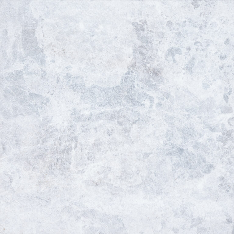 Textured surface of Tundra Grey Marble with intricate gray veining patterns throughout.
