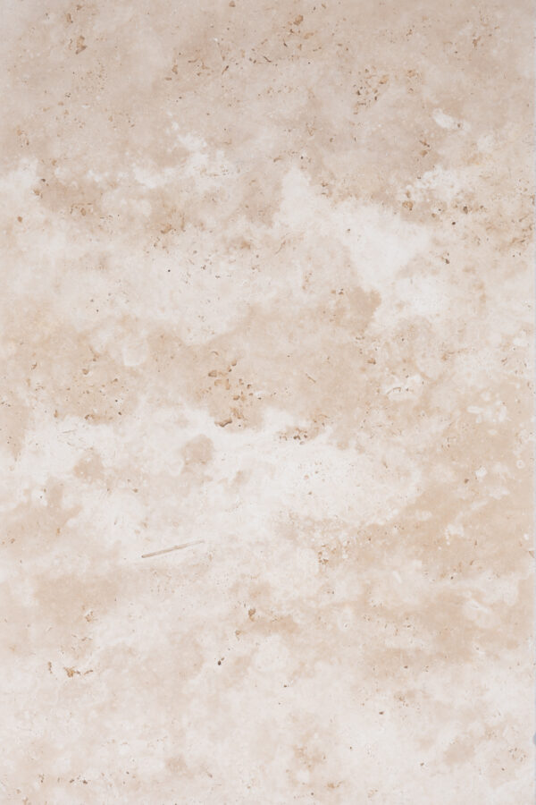 Image showing a detailed view of an Premium Ivory Travertine Tumbled Paver texture with natural patterns and slight variations in color intensity.