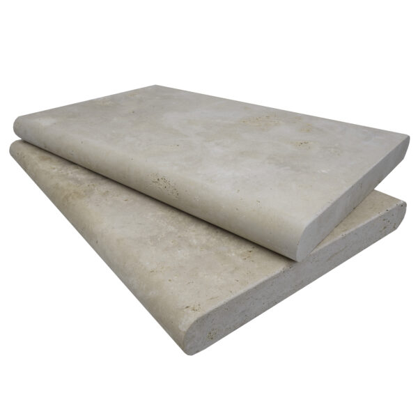 Two stacked Ivory Travertine Tumbled 16"x24"x2" Double Bullnose Copings on a plain background, displaying smooth surfaces with slight imperfections and discolorations.