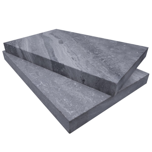 Two stacked Aegean Grey Marble Sand Blasted 16"x24"x2" Eased Edge Copings isolated on a white background, showing textured surfaces and eased edge.