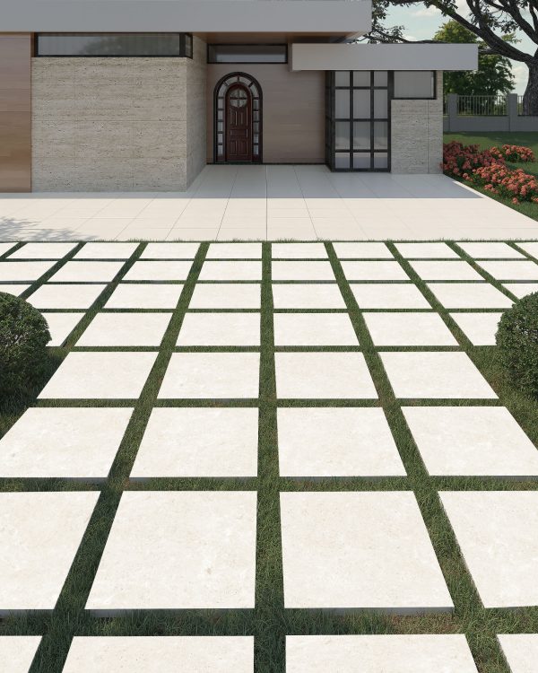 Modern house facade with Beige Travertine 24"x24" 2CM Matte Rectified Porcelain Pavers and a wooden door, featuring a geometric walkway made of alternating square porcelain pavers and grass strips, leading up to the entrance.