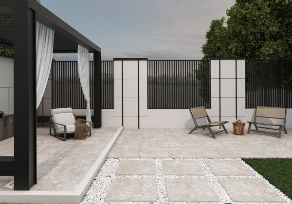 A modern patio area with a pergola, white flowing curtains, two loungers, and a sofa set on Silver Travertine 24