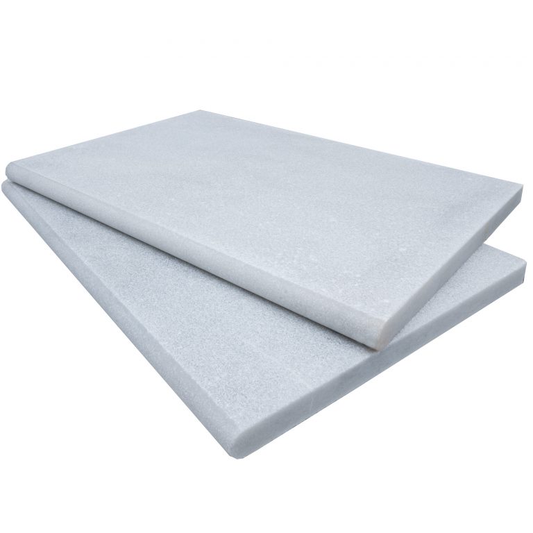 Two large, rectangular Afyon White Marble Sand Blasted 16"x24"x3CM Single Bullnose Copings stacked on top of each other, isolated on a white background.