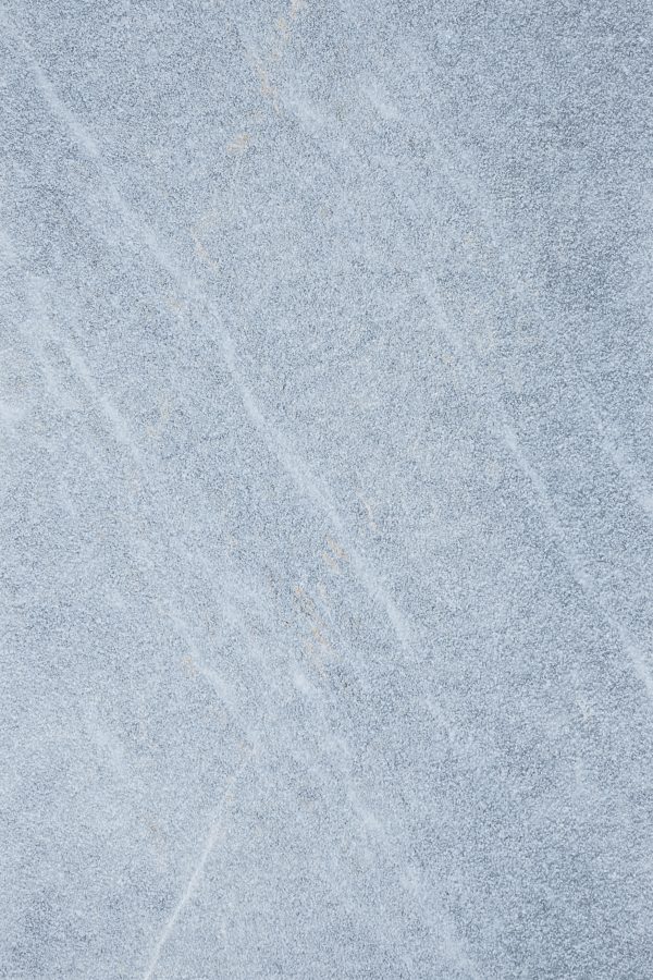 Close-up texture of a smooth Arctic Grey Marble Sand Blasted 16x24 3cm Paver surface with subtle wavy lines and faint yellow streaks.