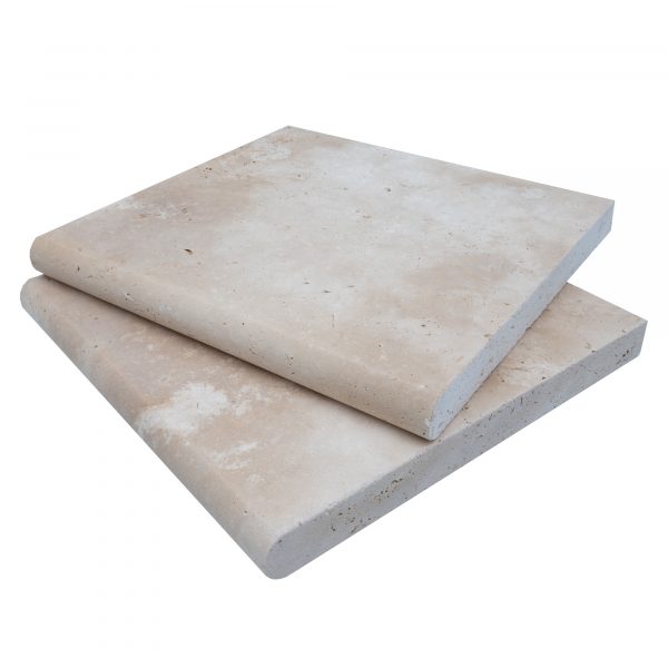 Two rectangular Ivory Travertine Tumbled 12"x12"x3CM Single Bullnose Copings stacked on top of each other, isolated on a white background. The copings have a smooth texture.