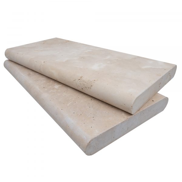 Two large rectangular Premium Ivory Travertine Tumbled 12"x24"x2" Double Bullnose Copings stacked on top of each other, isolated on a white background.