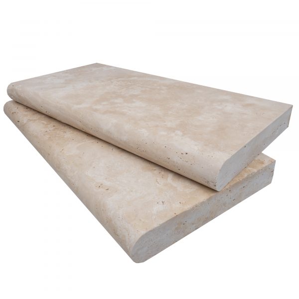 Two stacked Ivory Travertine Tumbled 12"x24"x2" Single Bullnose Copings with a smooth, light beige surface, displayed against a white background.