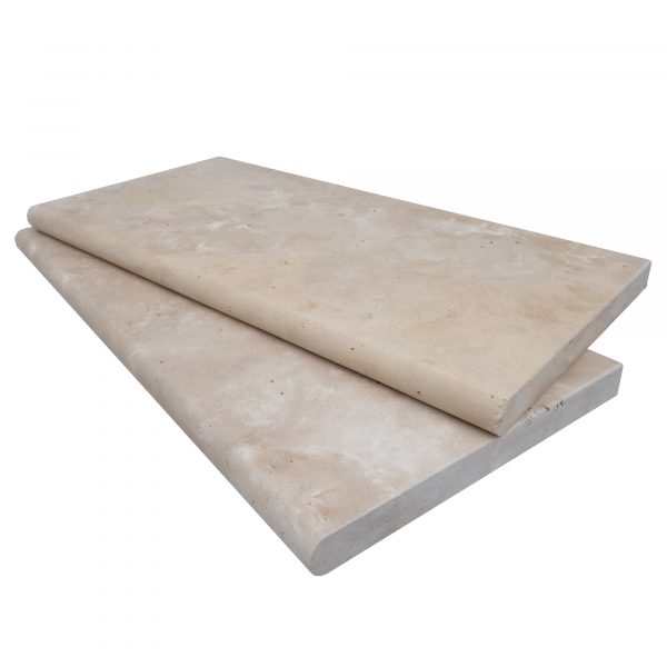 Two rectangular Premium Ivory Travertine Tumbled 12"x24"x3CM Single Bullnose Copings stacked on each other, displayed on a white background.