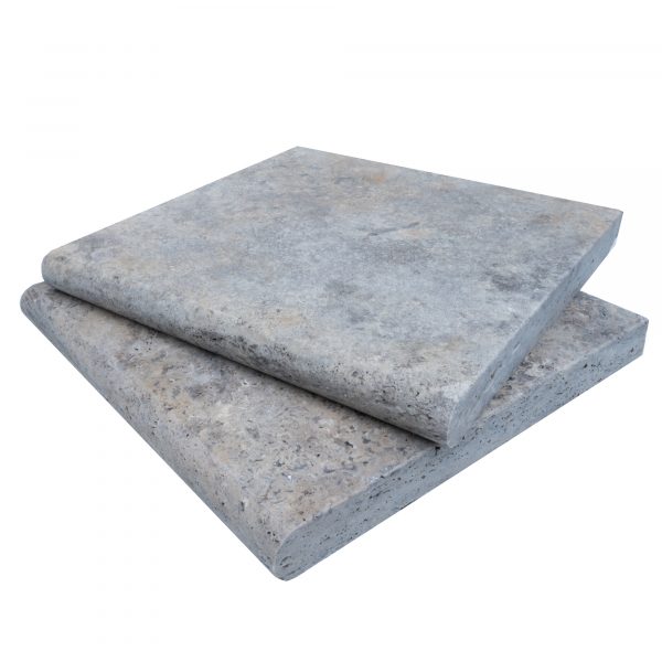 Two stacked Silver Travertine Tumbled 12"x12"x3CM Single Bullnose Copings isolated on a white background, showing detailed texture and edges.