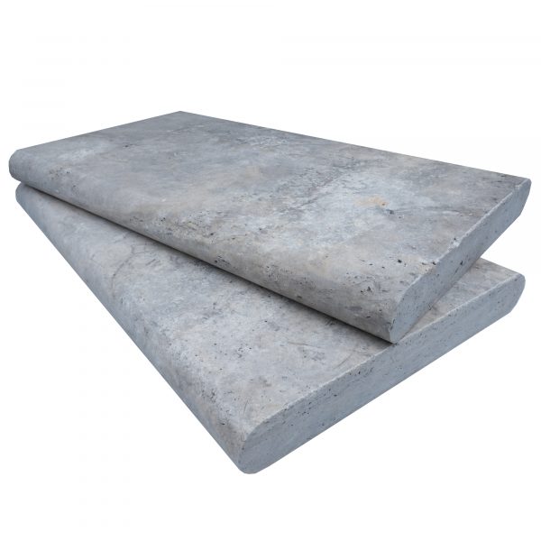 Two large Silver Travertine Tumbled 14"x24"x2" Double Bullnose Copings stacked diagonally on each other, isolated on a white background.