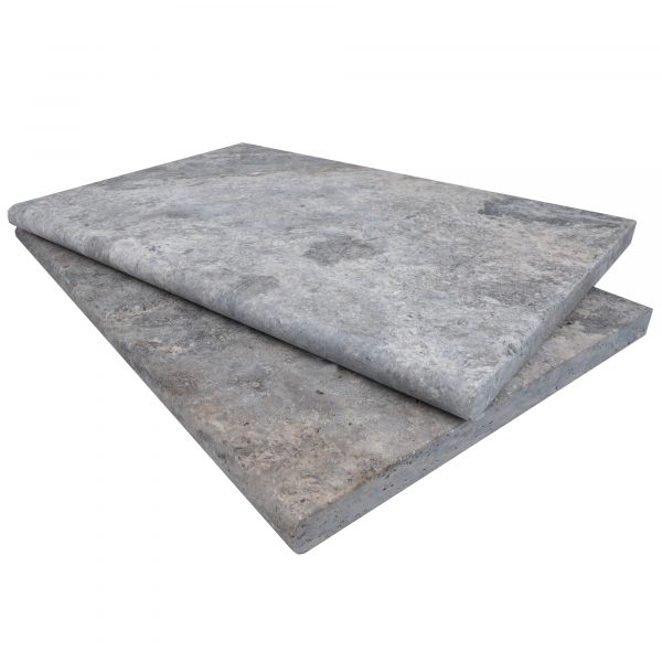 Two rectangular Silver Travertine Tumbled 16"x24"x3CM Single Bullnose Copings stacked on top of each other, displayed on a plain white background. The top slab slightly overlaps the bottom, showcasing textured surfaces.