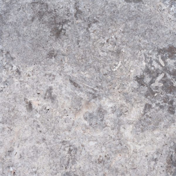 Texture of a gray, coarse Premium Silver Travertine Tumbled 24x24 in 3cm thickness surface with subtle shades and embedded small white particles, showing natural variations and veins.