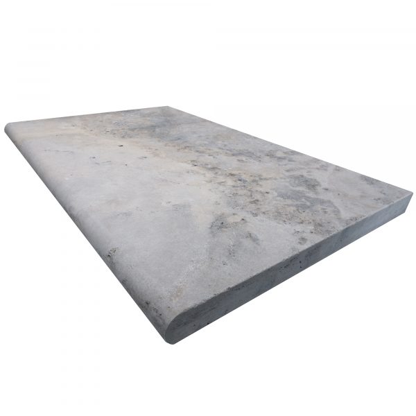 A rectangular Silver Travertine Tumbled 24"x36"x2" Single Bullnose Coping with a smooth, weathered surface and visible stains, isolated on a white background.
