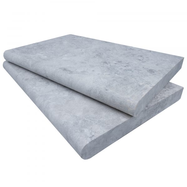 Two stacked Tundra Grey Marble Sand Blasted 16"x24"x2" Single Bullnose Copings with a smooth surface, set against a white background.