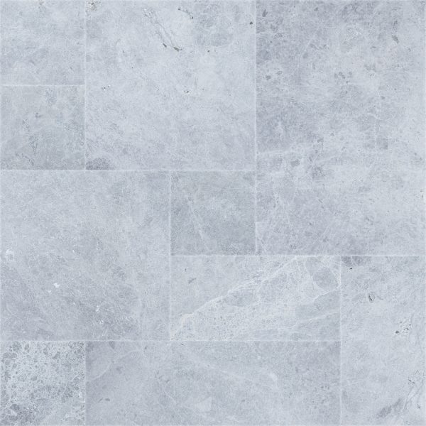 Tundra Grey Marble Sandblasted French Pattern with mix of different sizes.