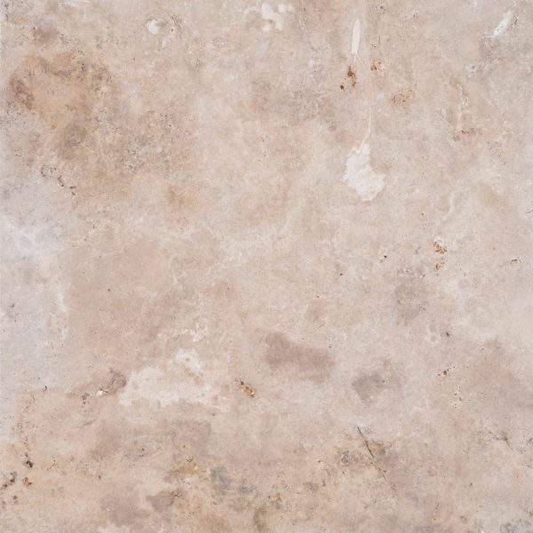 A close-up photograph of a textured Walnut Travertine Tumbled 24x24 3cm Paver surface with various natural patterns, speckles, and a few prominent blemishes.