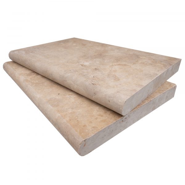 Two stacked Walnut Travertine Tumbled 16"x24"x2" Single Bullnose Copings with rough, textured surfaces and exposed edges. The copings appear dense and durable, suitable for construction. The background is plain.